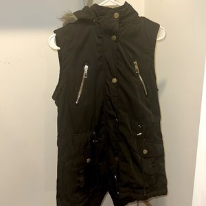 Women’s small black vest with fur-lined hood.